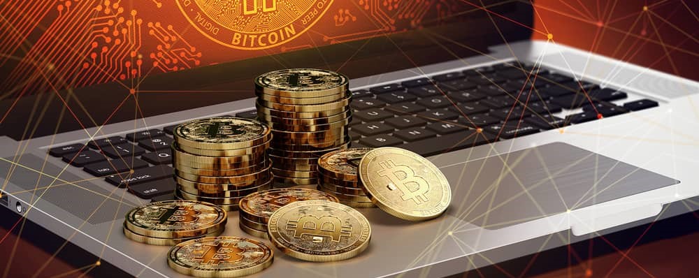 Bitcoins and a laptop